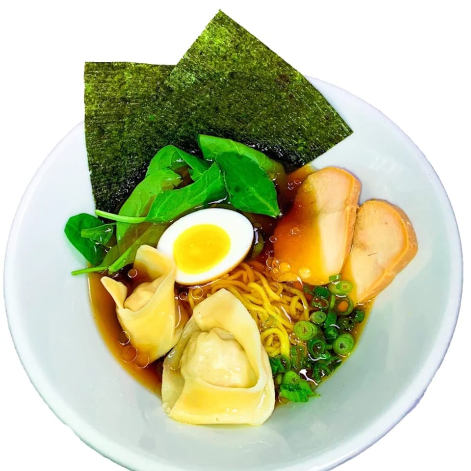 Aroma Ramen bowl with noodles, broth, wontons, egg, spinach, green onions, and nori.